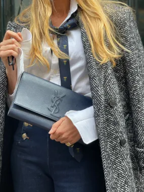"Belle du jour" navy clutch by Yves Saint Laurent.