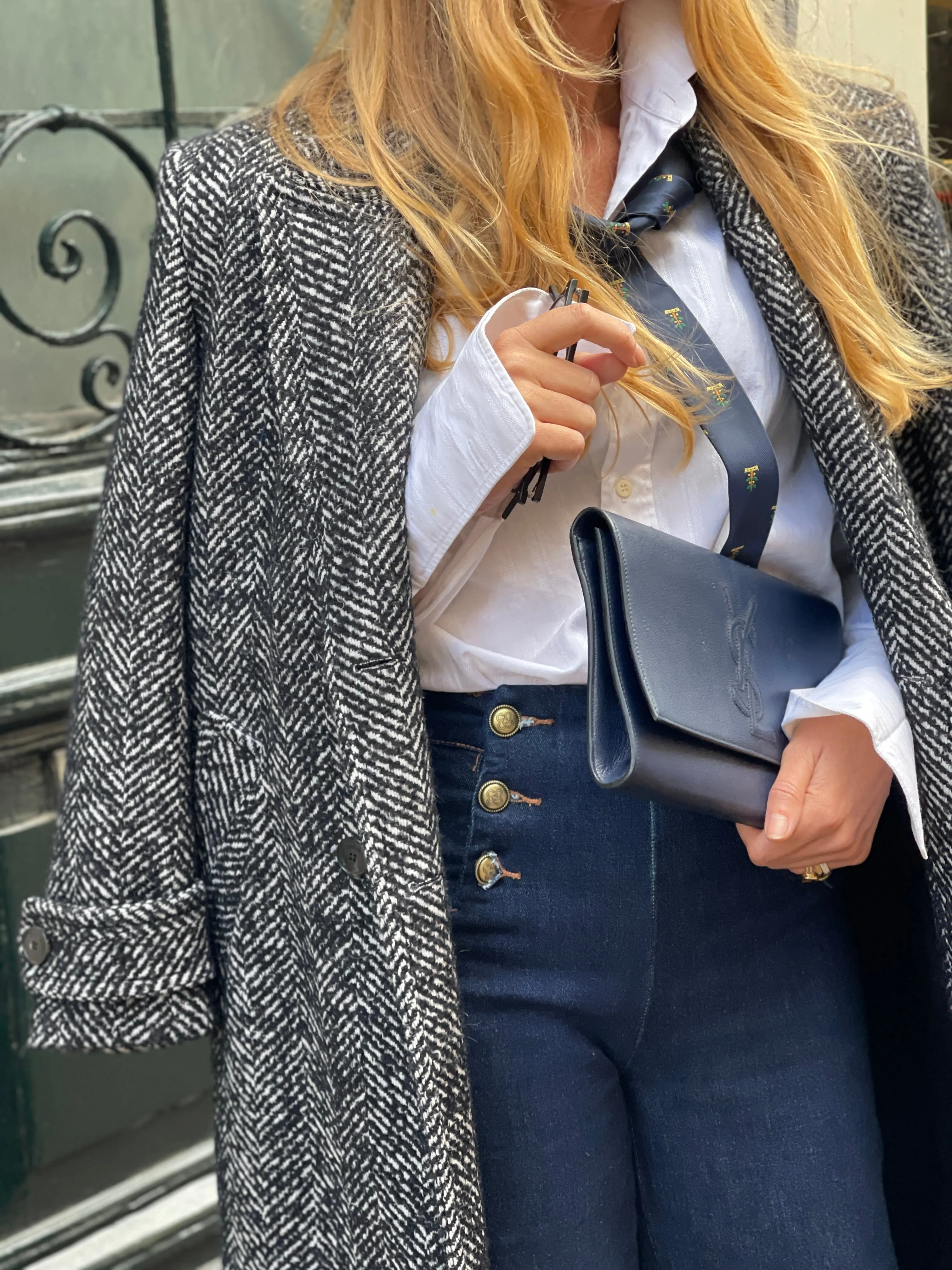 "Belle du jour" navy clutch by Yves Saint Laurent.